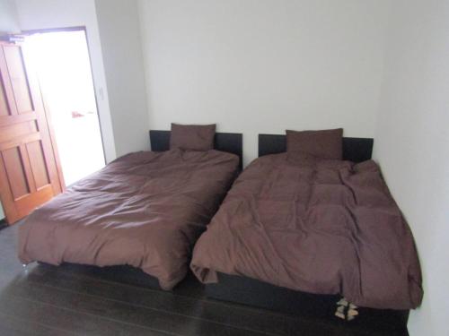 Кровать или кровати в номере Yuzawa Condo 一棟貸 貴重な駐車場2台無料