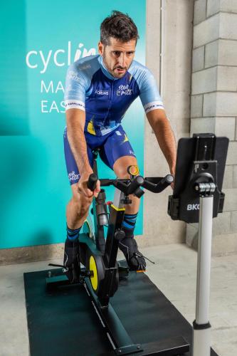a man is riding on an exercise bike at LAVIDA Hotel at Camiral, a Quinta do Lago Resort in Caldes de Malavella