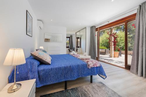 Ένα ή περισσότερα κρεβάτια σε δωμάτιο στο Villa Falco