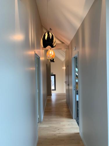 a hallway in a house with a ceiling at L'appartement et les Suites de VJL... in Avize