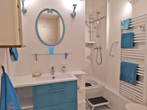 a bathroom with a sink and a shower at a lovely nest in Bussy-Saint-Georges