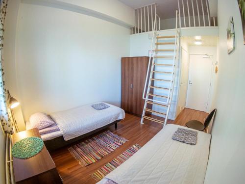Кровать или кровати в номере Lakehouse Saimaa B&B