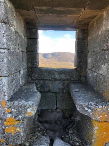 a window in a stone wall with a view at El Balcon de Los Sueños in Trevejo