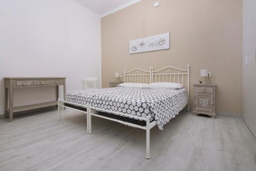 Giường trong phòng chung tại Residenza Serenella - Dependance