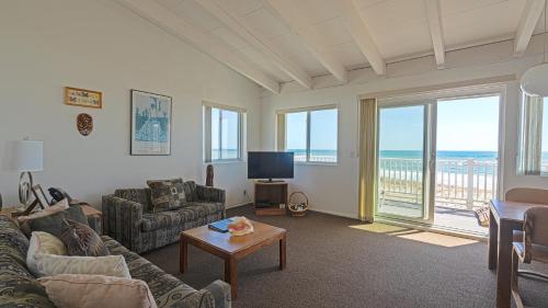 a living room with a view of the ocean at Sea Crest in Amagansett