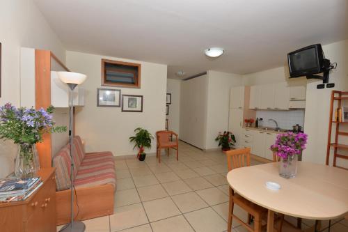 a living room with a couch and a table at Miramare Residence in Pozzuoli