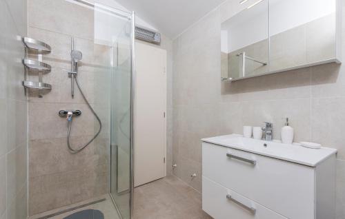 a bathroom with a shower and a sink at Apartments Hana in Funtana in Funtana