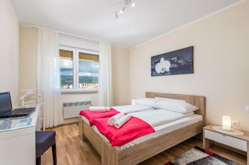 Postel nebo postele na pokoji v ubytování Orchidea apartment