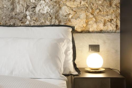 Postel nebo postele na pokoji v ubytování ISONZO SUITES