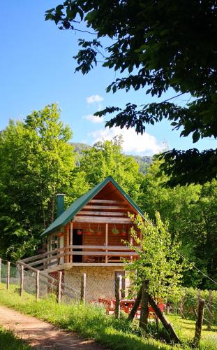 a log cabin with a fence in front of it at Koliba Pčelica 1-SPA in Bijelo Polje