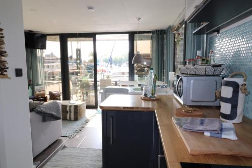 a kitchen with a counter with a microwave on it at Havenkoje in Cuxhaven