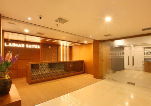 a lobby of a store with a glass wall at Laimar Suites in Cochin