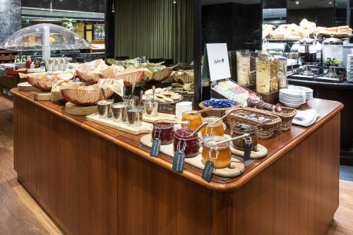 a display case in a store filled with lots of food at Radisson Blu Hotel Lisbon in Lisbon