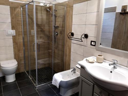 a bathroom with a shower and a sink and a toilet at Terra Dei Limoni in Noto Marina