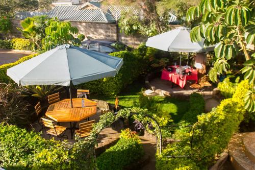 an overhead view of a garden with a table and umbrella at Zarita Boutique Hotel in Nairobi