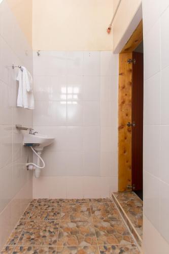 a bathroom with a sink and a toilet at Zarita Boutique Hotel in Nairobi