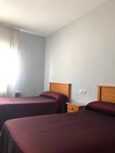 a hotel room with two beds and a window at Hotel Santa Fe in Santa Fe