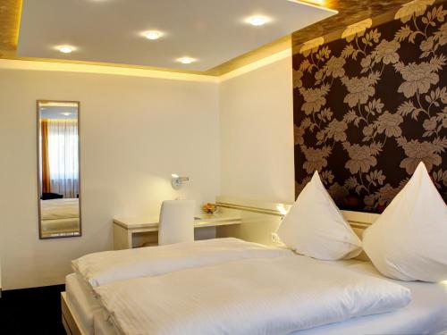 Postel nebo postele na pokoji v ubytování Hotel Linde