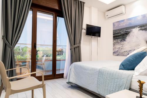 A bed or beds in a room at Cilento Suite - Vinarte B&B