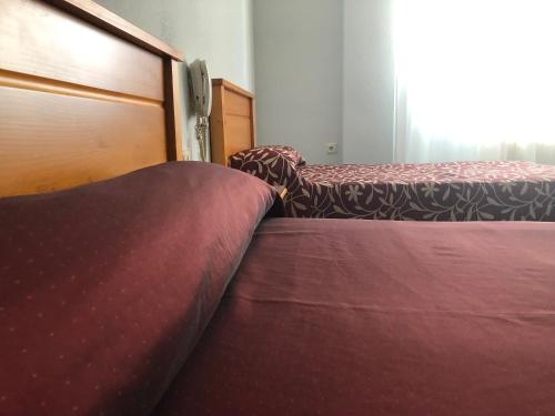 two beds sitting next to each other in a room at Hotel Santa Fe in Santa Fe