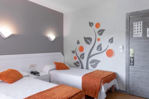 Hotel Los Naranjosにあるベッド