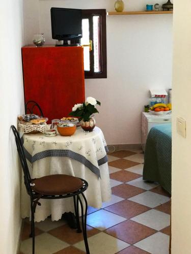 a room with a table with a table cloth on it at il giardino sul mare B&B in Riva Ligure
