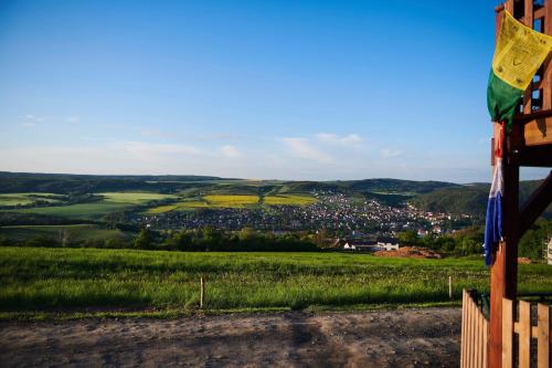 a view of a city from a farm field at Výhledna in Beroun