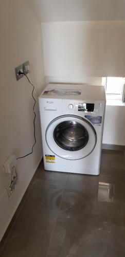 a washing machine in a corner of a room at Villa Anastasia Ksamil in Ksamil