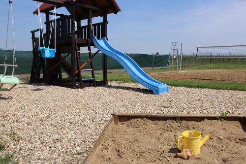 a playground with a blue slide at Penzion Kosík Tvrdonice in Tvrdonice