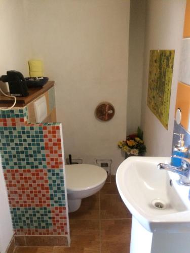 a bathroom with a toilet and a sink at U Sovičky in Olešník
