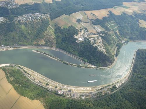 an aerial view of a body of water with a river at Das Loreley Weinstuebchen in Sankt Goarshausen