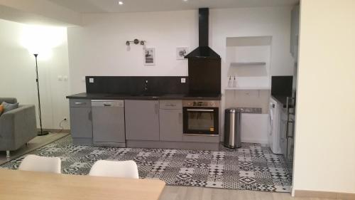 a kitchen with a stove and an oven at Mistral in Saint-Jean-de-Fos