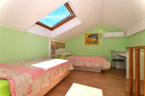 Katil atau katil-katil dalam bilik di Apartments Tomislav
