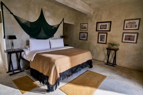 Кровать или кровати в номере Coqui Coqui Papholchac Coba Residence & Spa