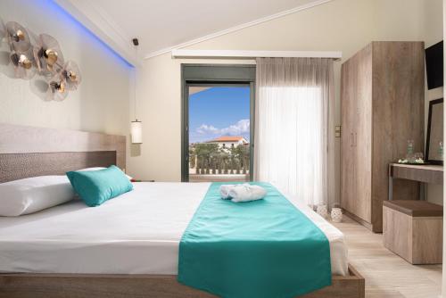 Ένα ή περισσότερα κρεβάτια σε δωμάτιο στο Aelia suites