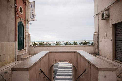 a stairway in a building with a sign on it at La Dolce Vista - B&B di Charme in Manfredonia