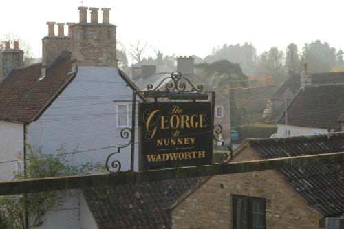 a sign for the grove of minnie walkership at The George at Nunney in Frome
