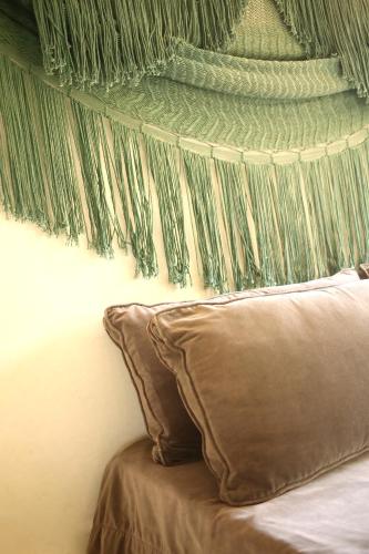 a bedroom with a bed with a green ceiling at Coqui Coqui Papholchac Coba Residence & Spa in Cobá