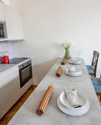 Kuchyň nebo kuchyňský kout v ubytování Letna Garden Suites