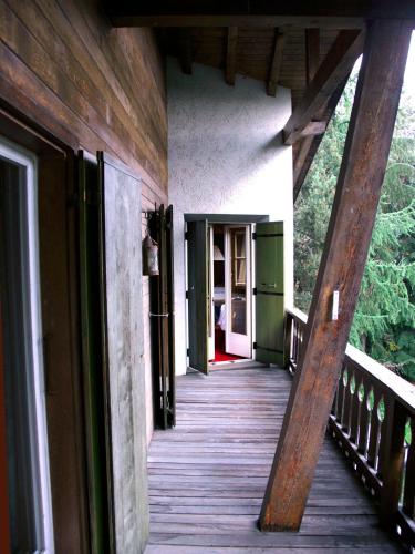 a wooden walkway leading to a door on a house at Arche de Noé B&B in Verbier