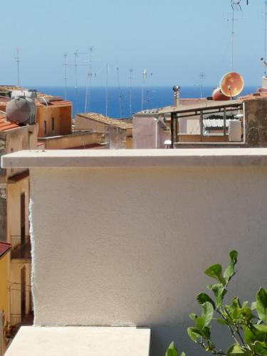 a view of the ocean from the roof of a building at Atrium in Castellammare del Golfo