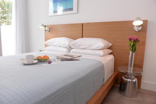 Ένα ή περισσότερα κρεβάτια σε δωμάτιο στο 6080 Design Hotel by Eskape Collection