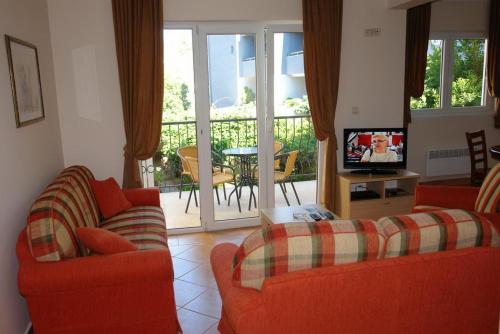 TV i/ili multimedijalni sistem u objektu Villa Franeta Apartments
