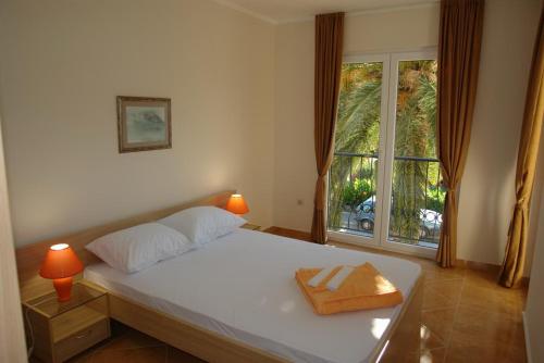 Кровать или кровати в номере Villa Franeta Apartments