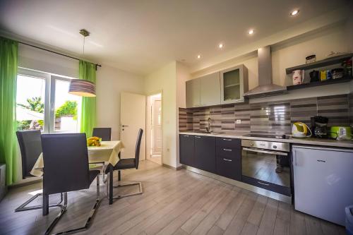 Kuchyň nebo kuchyňský kout v ubytování Apartman Carmen Volosko
