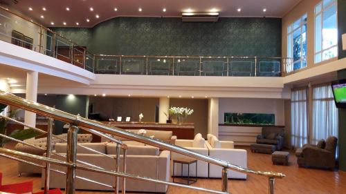a living room with a staircase and a lobby at CATANGE HOTEL in Charata