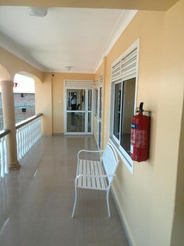 a fire hydrant is on the side of a building at Karibu BB Suites in Entebbe