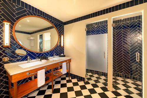 a bathroom with a sink and a mirror at Ocean el Faro Resort - All Inclusive in Punta Cana