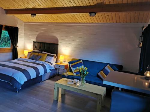 מיטה או מיטות בחדר ב-Westport Country Chalets