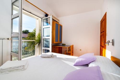 מיטה או מיטות בחדר ב-Apartments Bari - 140 m from beach